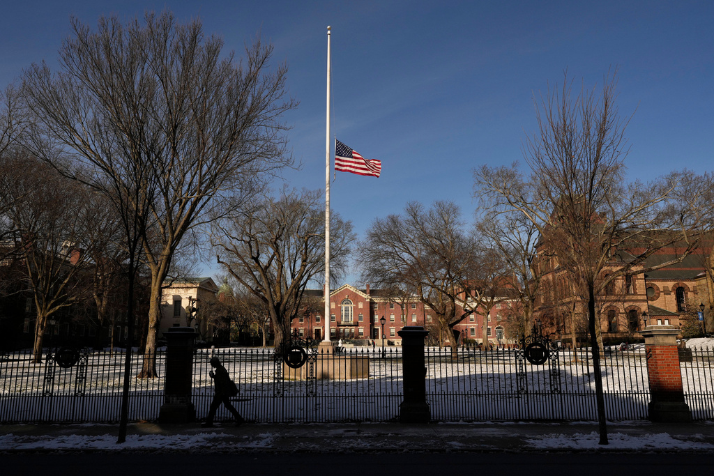 The United States flag flies at half-staff as a sign of mourning for the victim's of Saturday's shooting, on the campus of Brown University, Monday, Dec. 15, 2025, in Providence, R.I. (AP Photo/Robert F. Bukaty)