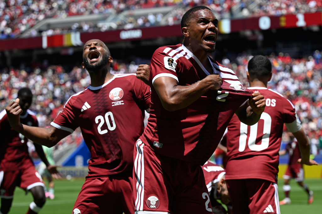 Qatar's Pedro Miguel, yells as he celebrates after teammate Qatar's Boualem Khoukhi, scored his sides first goal during the World Cup Group B soccer match between Qatar and Switzerland in Santa Clara, Calif., near San Francisco, Saturday, June 13, 2026. (AP Photo/Eakin Howard)