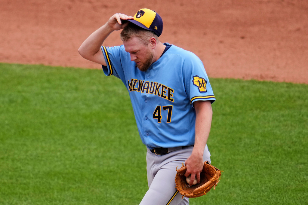 Milwaukee Brewers pitcher Jared Koenig collects himself on the mound during the fourth inning of a baseball game against the Pittsburgh Pirates in Pittsburgh, Sunday, July 12, 2026. (AP Photo/Gene J. Puskar)