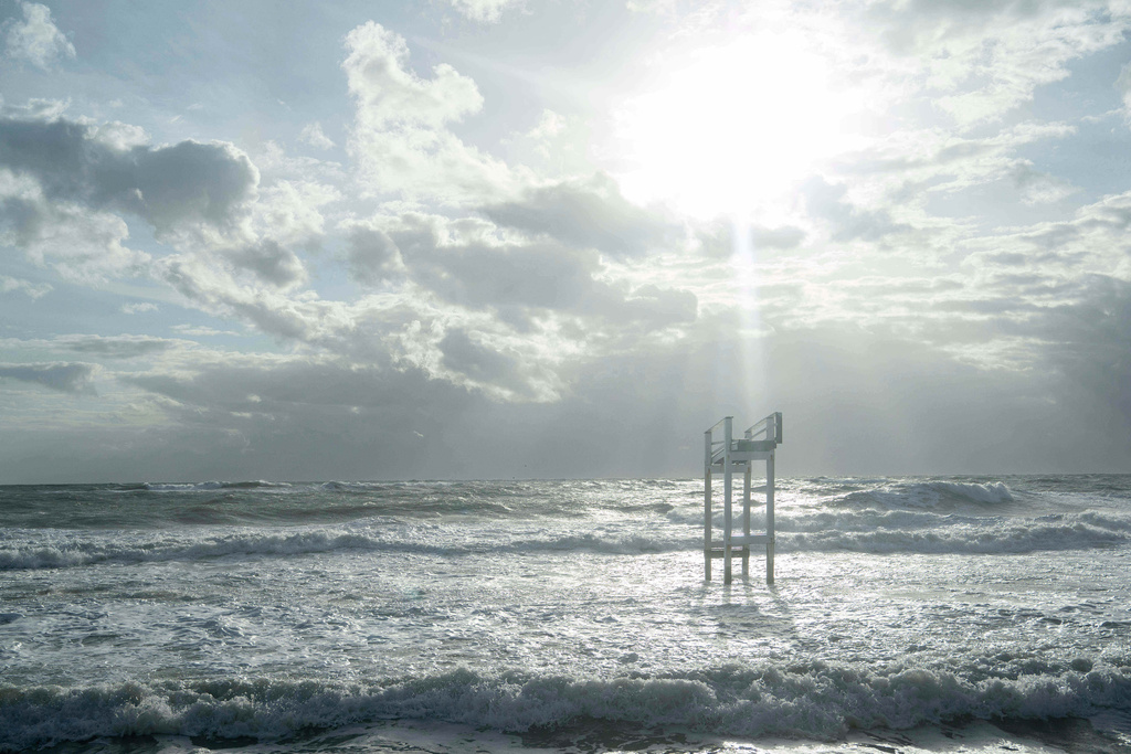 The lone remains of a home stand in the ocean as a storm approaches Friday, Oct. 10, 2025, in Buxton, N.C. (AP Photo/Allison Joyce)