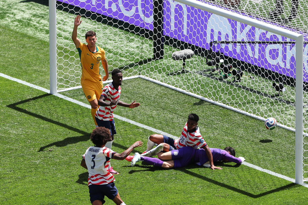 Australia's Aiden O'Neill (13) appeals for offside after United States' Alex Freeman (16) scored a goal past Australia goalkeeper Patrick Beach (18) during the World Cup Group D soccer match between the United States and Australia in Seattle, Friday, June 19, 2026. (AP Photo/Maddy Grassy)