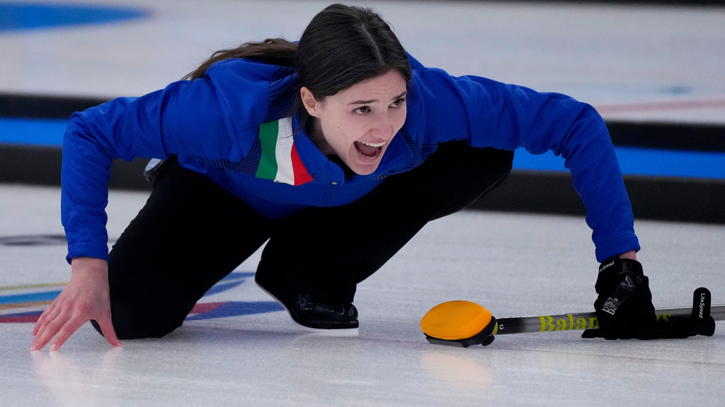 FILE -Italy's Stefania Constantini, directs her team mate, during the mixed doubles curling match against Sweden, at the 2022 Winter Olympics, Feb. 6, 2022, in Beijing. (AP Photo/Nariman El-Mofty, File)