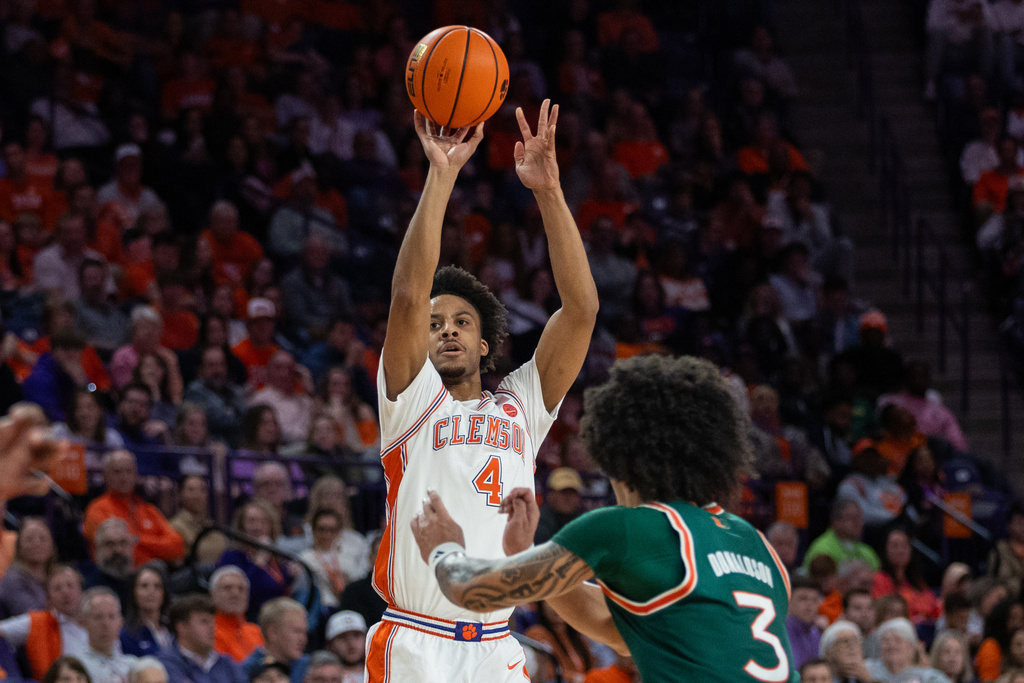 Clemson guard Efrem Johnson (4) shoots against Miami during the first half of an NCAA college basketball game Saturday, Jan. 17, 2026, in Clemson, S.C. (AP Photo/Scott Kinser)