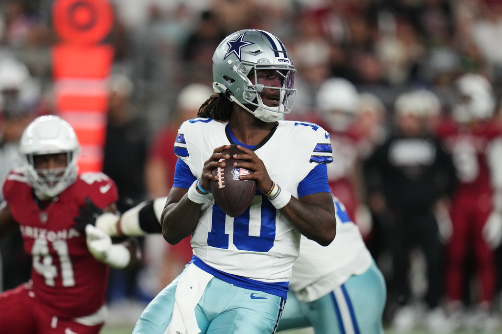 Dallas Cowboys quarterback Joe Milton III (10) drops back to pass in the first half of a preseason NFL football game against the Arizona Cardinals Saturday, Aug. 22, 2026, in Glendale, Ariz. (AP Photo/Rick Scuteri)