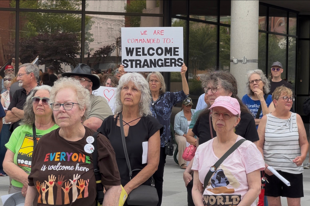 This photo made from video shows people at a rally in support of Haitians on Thursday, June 25, 2026, in Springfield, Ohio, after the United States Supreme Court ruled that the Trump administration can end temporary protected status for Haitians and Syrians. (AP Photo/Patrick Aftoora-Orsagos)