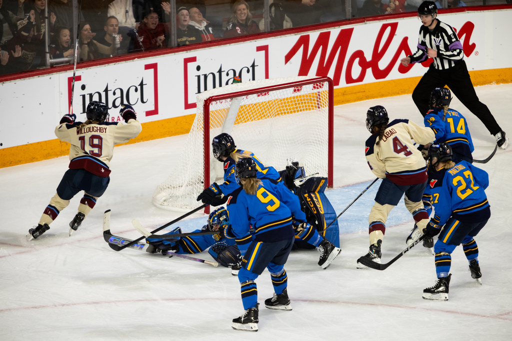 Montreal Victoire's Kaitlin Willoughby (19) celebrates her goal on Toronto Sceptres goaltender Raygan Kirk (1) during the first period of a PWHL Takeover Tour game in Halifax, on Wednesday, Dec. 17, 2025. (Riley Smith/The Canadian Press via AP)
