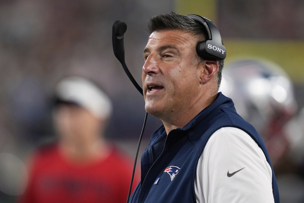 New England Patriots head coach Mike Vrabel stands on the sideline during the first half of an NFL preseason football game against the Washington Commanders Friday, Aug. 8, 2025, in Foxborough, Mass. (AP Photo/Charles Krupa)