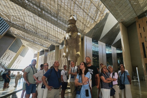 Tourists stand under the statue of Pharaoh Ramses II, at the Grand Egyptian Museum in Giza, Egypt, Friday, May 23, 2025. (AP Photo/Amr Nabil) Tourists stand under the statue of Pharaoh Ramses II, at the Grand Egyptian Museum in Giza, Egypt, Friday, May 23, 2025. (AP Photo/Amr Nabil)