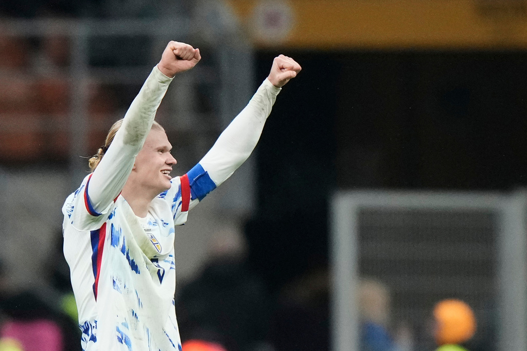 Norway's Erling Haaland celebrates after scoring his side's third goal during the 2026 World Cup Group I qualifier soccer match between Italy and Norway in Milan, Italy, Sunday, Nov. 16, 2025. (AP Photo/Luca Bruno)