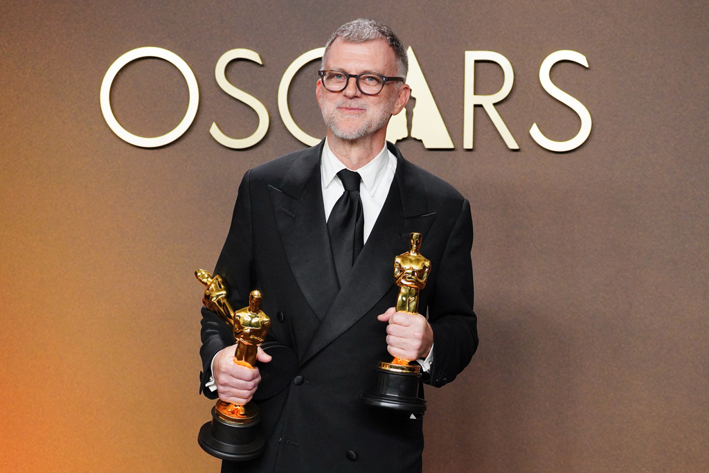 Paul Thomas Anderson, winner of the awards for writing (adapted screenplay), directing, and best picture for "One Battle After Another," poses in the press room at the Oscars on Sunday, March 15, 2026, at the Dolby Theatre in Los Angeles. (Photo by Jordan Strauss/Invision/AP)
