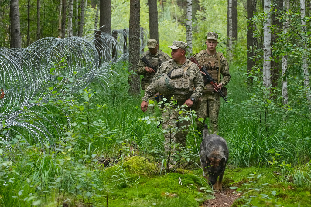 Ukrainian border guards patrol Ukraine-Belarus border in an undisclosed location in Ukraine Tuesday, July 7, 2026. (AP Photo/Efrem Lukatsky)