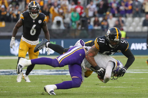 Pittsburgh Steelers linebacker Nick Herbig (51) and Minnesota Vikings quarterback Carson Wentz (11) challenge for the ball during the NFL football game between Minnesota Vikings and Pittsburgh Steelers at Croke Park stadium in Dublin, Sunday, Sept. 28, 2025.(AP Photo/Peter Morrison) Pittsburgh Steelers linebacker Nick Herbig (51) and Minnesota Vikings quarterback Carson Wentz (11) challenge for the ball during the NFL football game between Minnesota Vikings and Pittsburgh Steelers at Croke Park stadium in Dublin, Sunday, Sept. 28, 2025.(AP Photo/Peter Morrison)