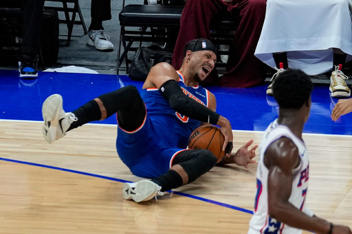 New York Knicks' Josh Hart reacts as he falls during the first half of an NBA preseason basketball game against the Philadelphia 76ers, Thursday, Oct. 2, 2025, in Abu Dhabi, United Arab Emirates. (AP Photo/Altaf Qadri) New York Knicks' Josh Hart reacts as he falls during the first half of an NBA preseason basketball game against the Philadelphia 76ers, Thursday, Oct. 2, 2025, in Abu Dhabi, United Arab Emirates. (AP Photo/Altaf Qadri)