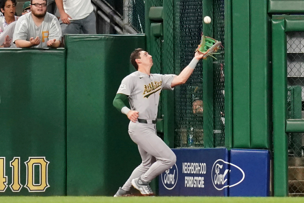 Athletics left fielder Tyler Soderstrom catches a fly ball hit by Pittsburgh Pirates' Henry Davis during the fourth inning of a baseball game Saturday, Sept. 20, 2025, in Pittsburgh. (AP Photo/Matt Freed)