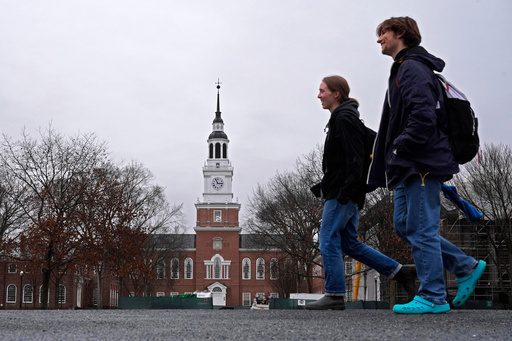 FILE - Students cross the campus of Dartmouth College, March 5, 2024, in Hanover, N.H. (AP Photo/Robert F. Bukaty, File) FILE - Students cross the campus of Dartmouth College, March 5, 2024, in Hanover, N.H. (AP Photo/Robert F. Bukaty, File)