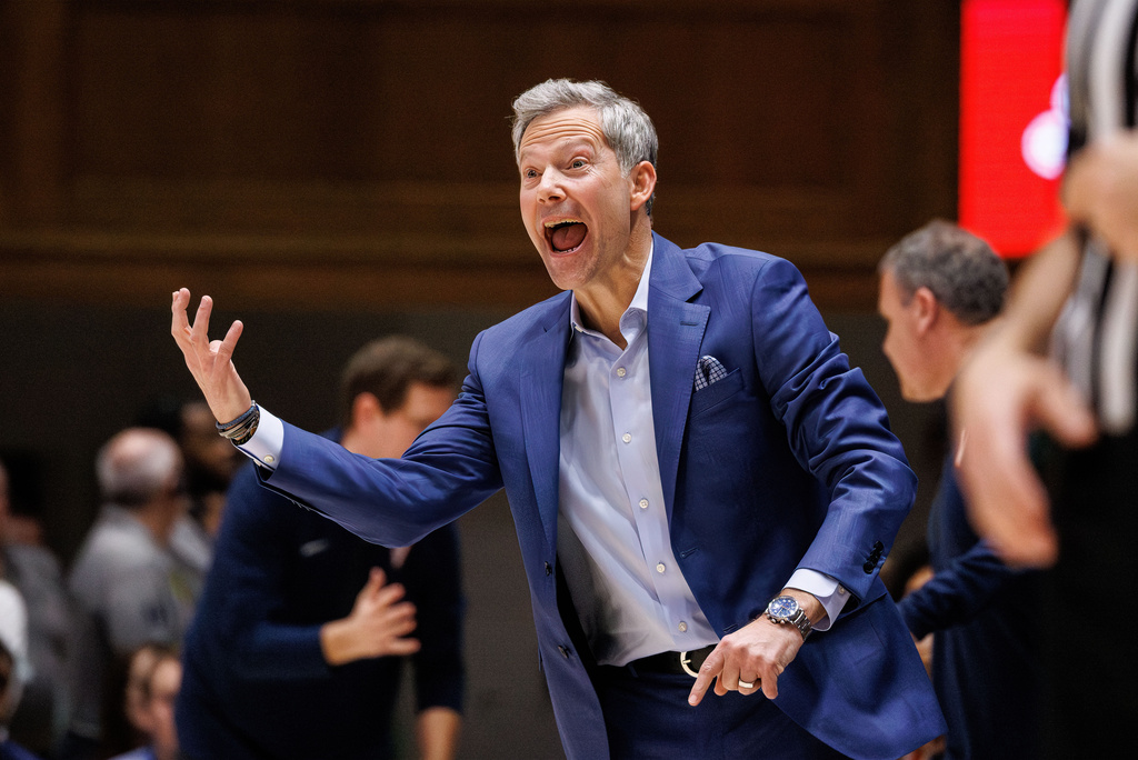 Virginia head coach Ryan Odom gestures towards the floor during the first half of an NCAA college basketball game against Duke in Durham, N.C., Saturday, Feb. 28, 2026. (AP Photo/Ben McKeown)