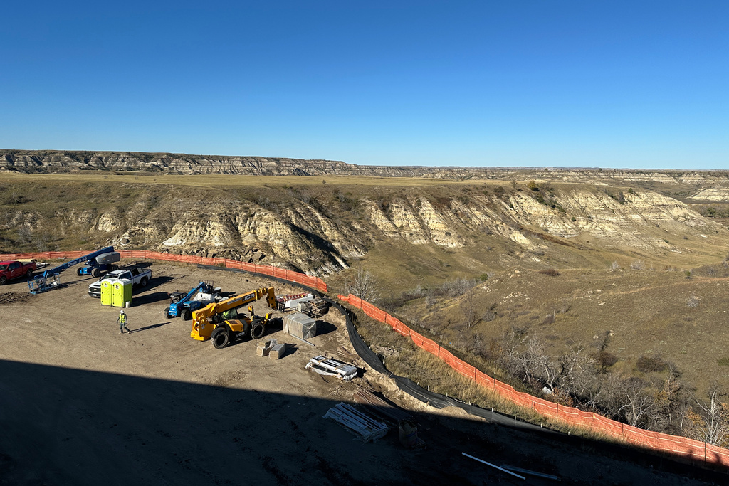 The view atop the roof of the Theodore Roosevelt Presidential Library shows the rugged Badlands landscape Tuesday, Oct. 7, 2025, near Medora, N.D. (AP Photo/Jack Dura)