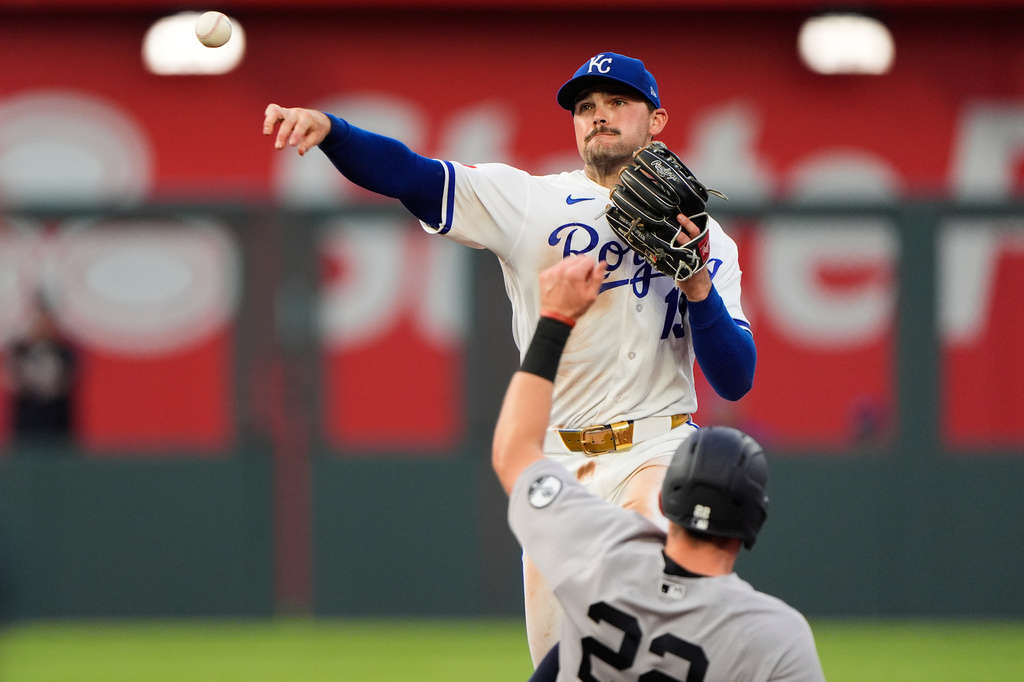 Kansas City Royals second baseman Michael Massey throws to first for the double play hit into by New York Yankees' Aaron Judge after forcing Ben Rice (22) out at second during the sixth inning of baseball game Wednesday, May 27, 2026, in Kansas City, Mo. (AP Photo/Charlie Riedel)