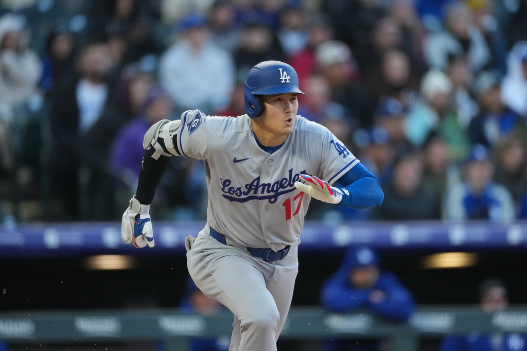Los Angeles Dodgers' Shohei Ohtani heads up the first-base line after connecting for a double off Colorado Rockies starting pitcher Tomoyuki Sugano in the first inning of a baseball game Friday, April 17, 2026, in Denver. (AP Photo/David Zalubowski)