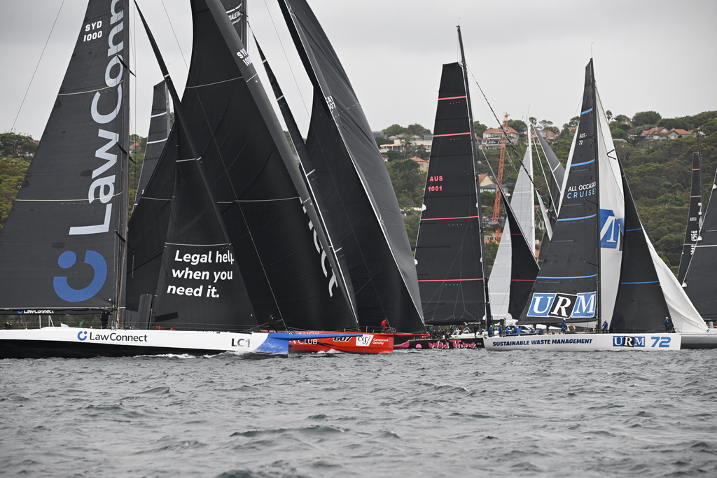 Competitors race towards Sydney Heads during the start of the Sydney Hobart yacht race in Sydney, Friday, Dec. 26, 2025. (Dean Lewins/AAP Image via AP)