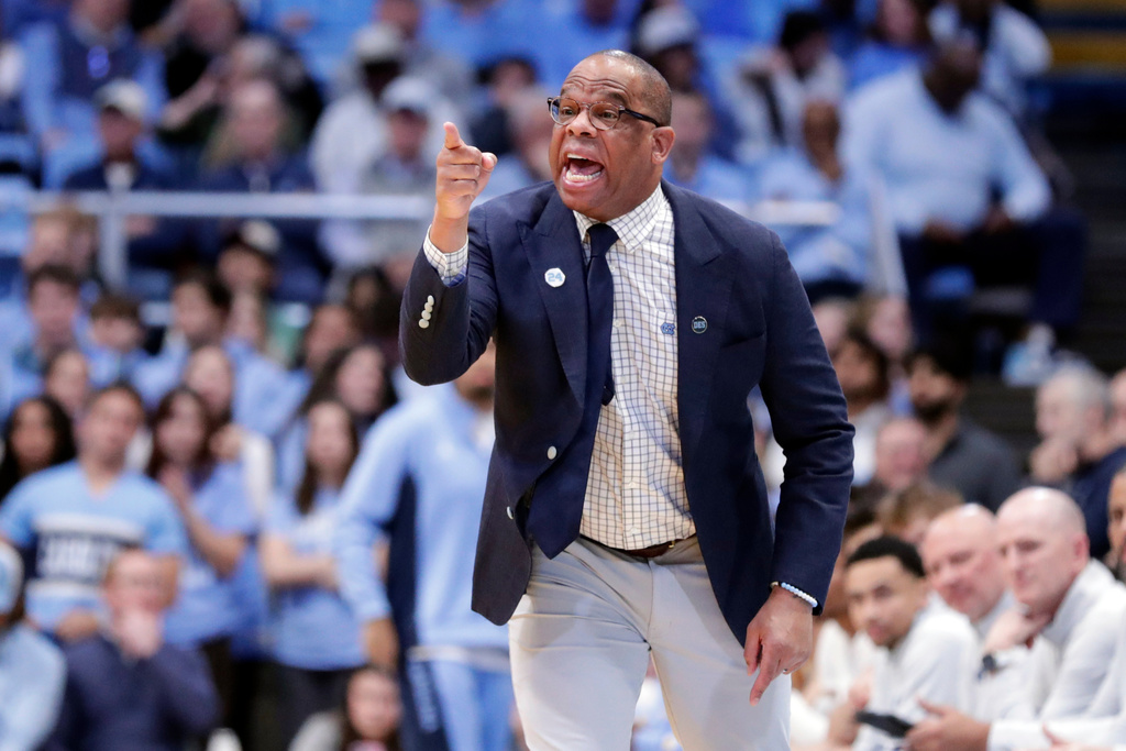 North Carolina head coach Hubert Davis directs the team against East Tennessee State during the first half of an NCAA college basketball game Tuesday, Dec. 16, 2025, in Chapel Hill, N.C. (AP Photo/Chris Seward)