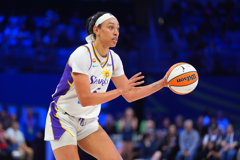 Los Angeles Sparks forward Dearica Hamby handles the ball during the first half of a WNBA basketball game against the Dallas Wings in Arlington, Texas, Thursday, Sept. 17, 2026. (AP Photo/LM Otero)
