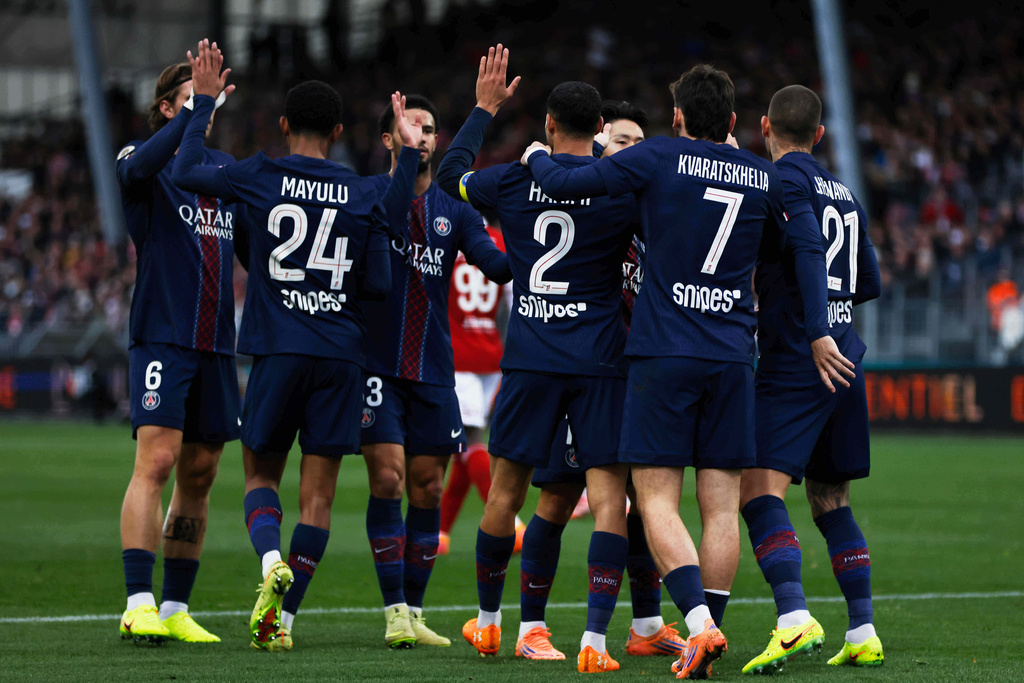 PSG's Achraf Hakimi, fourth from left, celebrates with his teammates after scoring his side's opening goal during the French League One soccer match between Brest and Paris Saint Germain in Brest, France, Saturday, Oct. 25, 2025. (AP Photo/Jeremias Gonzalez)