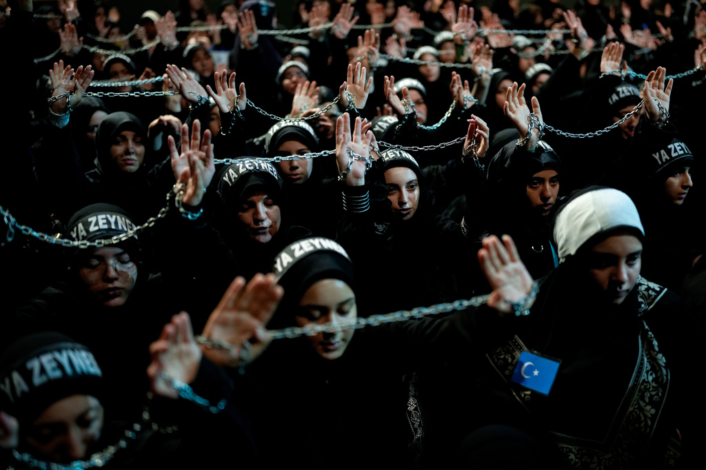 Shiite faithful Muslims attend an Ashoura procession which commemorates the 7th-century martyrdom of Imam Hussein in Istanbul, Turkey, Thursday, June 25, 2026. (AP Photo/Emrah Gurel)