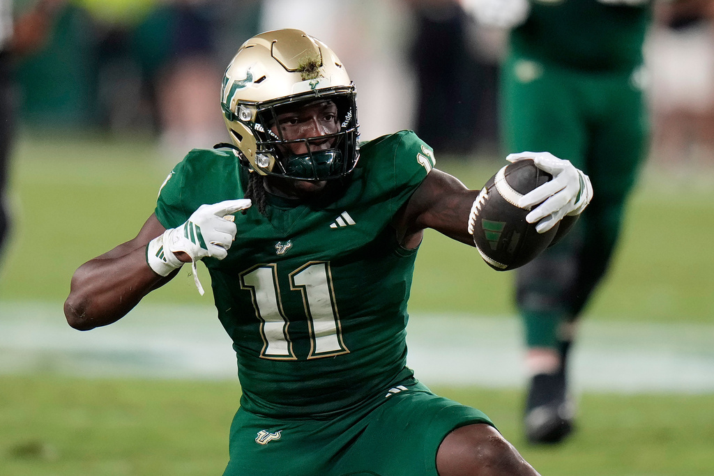 South Florida Bulls wide receiver Keshaun Singleton celebrates after making a first down against Florida Atlantic during the first half of an NCAA college football game Saturday, Oct. 18, 2025, in Tampa, Fla. (AP Photo/Chris O'Meara)