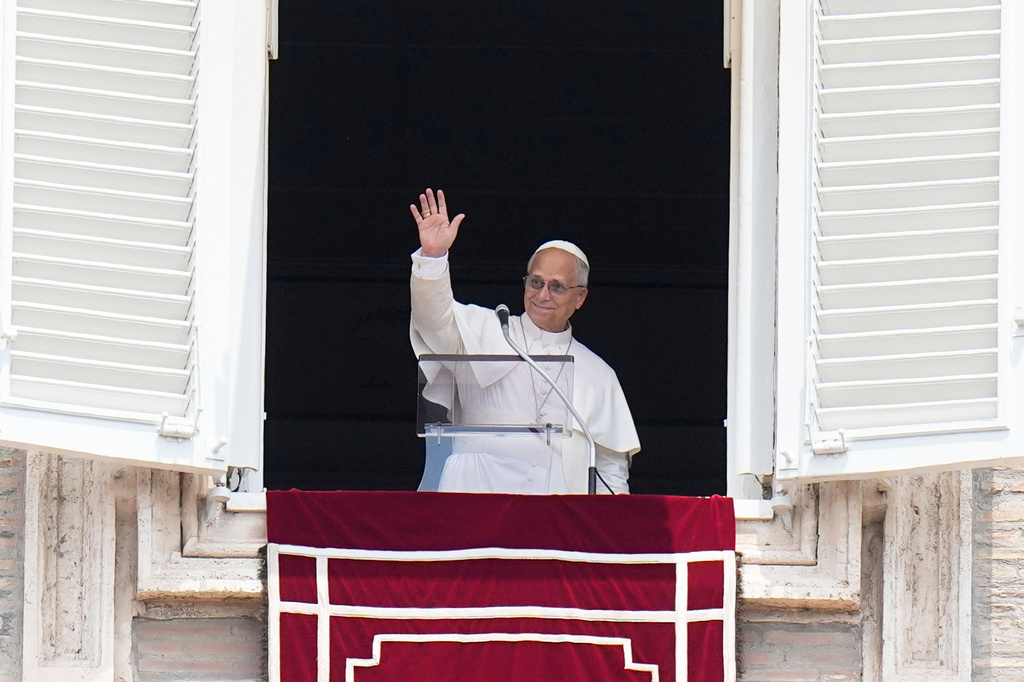 Pope Leo XIV waves during the Angelus noon prayer from the window of his studio overlooking St.Peter's Square, at the Vatican, Monday, June 29, 2026. (AP Photo/Alessandra Tarantino)