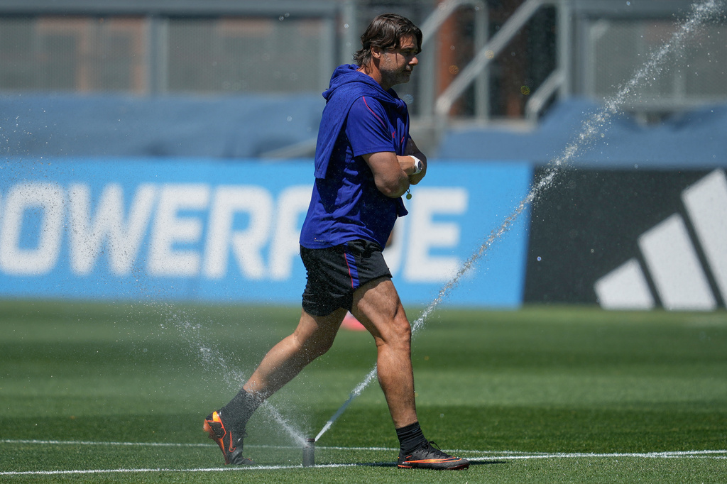United States head coach Mauricio Pochettino steps over a sprinler during a training session ahead of their World Cup Round of 32 soccer match against Bosnia and Herzegovina, Tuesday, June 30, 2026, in San Jose, Calif. (AP Photo/Eugene Hoshiko)