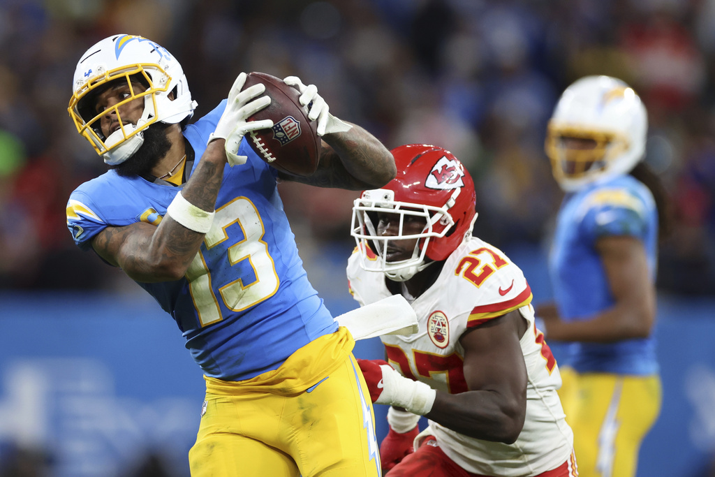Los Angeles Chargers wide receiver Keenan Allen catches a pass ahead of Kansas City Chiefs safety Chamarri Conner during the second half of an NFL football game, Friday, Sept. 5, 2025, in Sao Paulo. (AP Photo/Jeff Lewis)