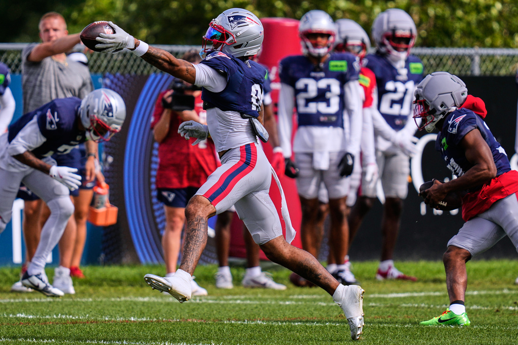 New England Patriots cornerback Christian Gonzalez catches a pass during an NFL football training camp, Tuesday, Aug. 25, 2026, in Foxborough, Mass. (AP Photo/Charles Krupa)
