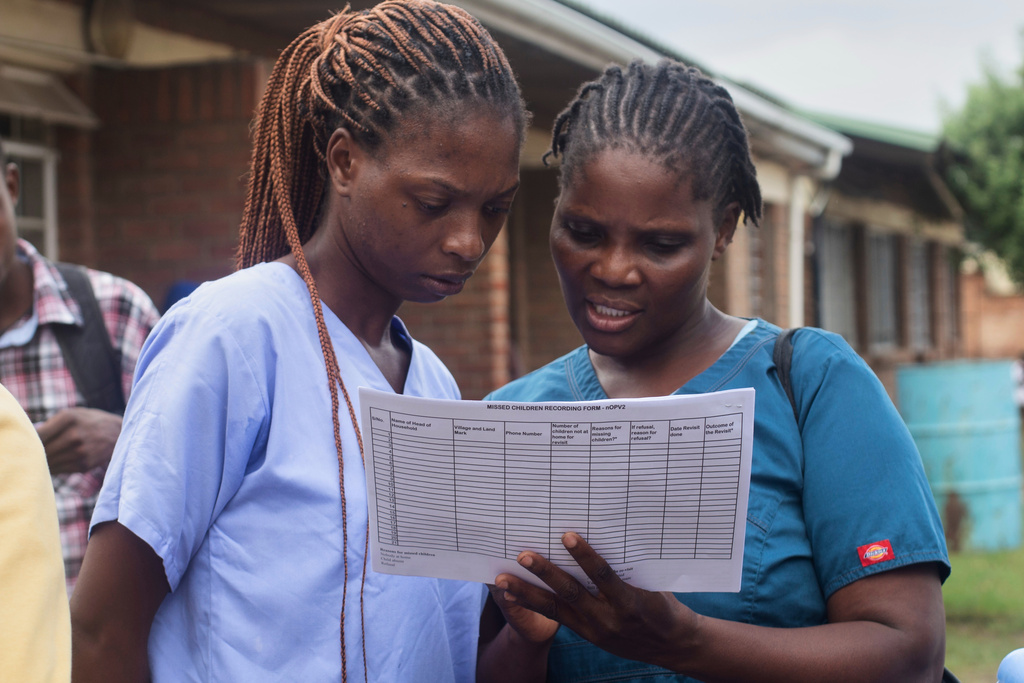 Health workers get ready to administer oral polio vaccines to children in the Ndirande Township of Blantyre, Malawi, Wednesday, Feb. 11, 2026. (AP Photo/Kenneth Jali)