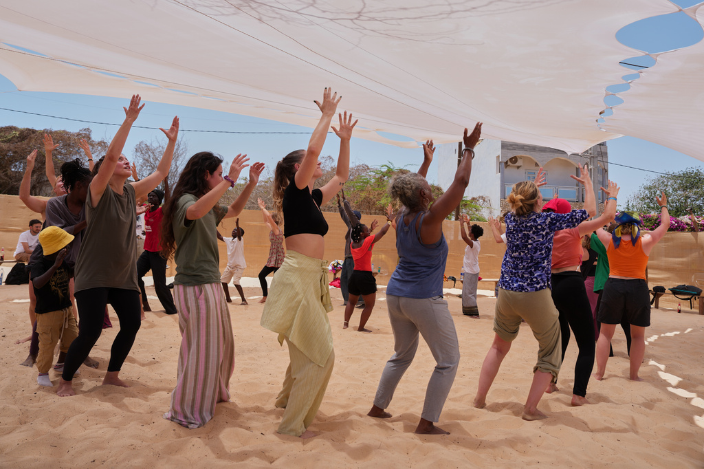 People attend a dance workshop at the Biennale of Dance in Africa, held at Ecole des Sables in Toubab Dialaw, Senegal, Saturday, May 2, 2026. (AP Photo/Misper Apawu)