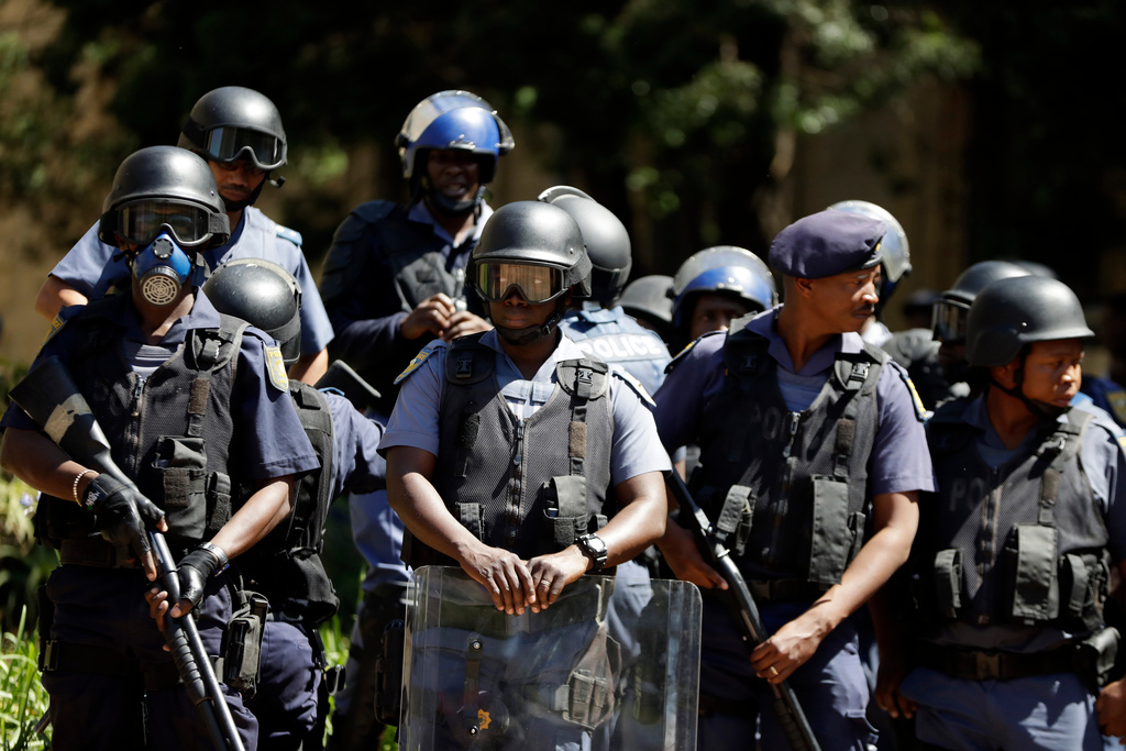 FILE -South African riot police stand outside the great hall at the University of the Witwatersrand in Johannesburg, South Africa, Oct. 11, 2016. (AP Photo/Themba Hadebe, File)
