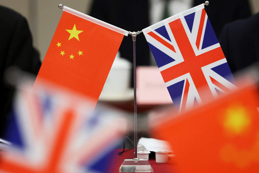 FILE - Flags of China and the Union Jack stand during the China-UK Energy Dialogue in Beijing, China, March 17, 2025. (Florence Lo/Pool Photo via AP, file)