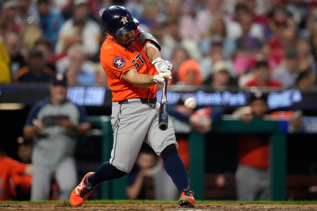 Houston Astros' Jose Altuve hits a double against Philadelphia Phillies pitcher Cristopher Sánchez for his 2,500th career hit during the third inning of a baseball game Wednesday, Sept. 9, 2026, in Philadelphia. (AP Photo/Matt Slocum)
