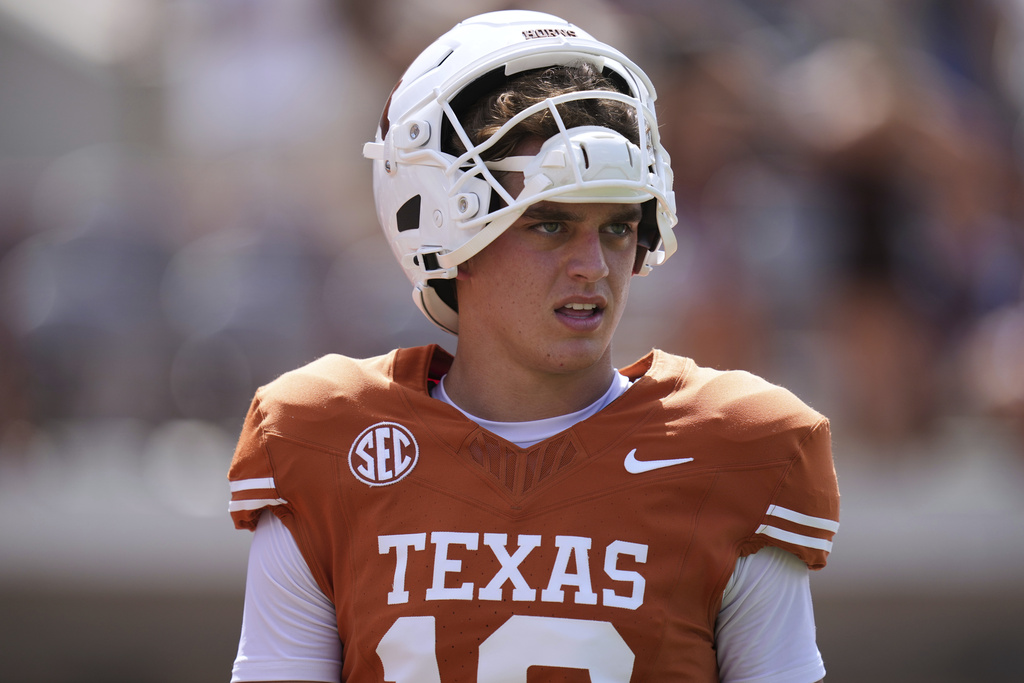 Texas quarterback Arch Manning (16) warms up before an NCAA college football game against UTEP in Austin, Texas, Saturday, Sept. 13, 2025. (AP Photo/Eric Gay)