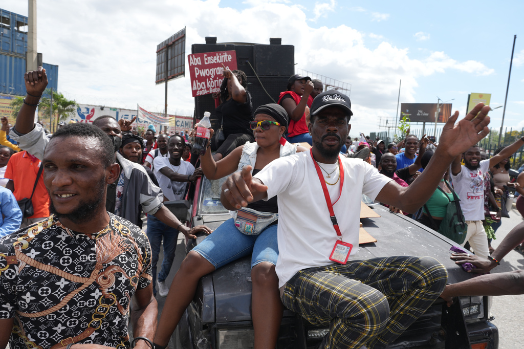 Factory workers march to demand a salary increase in Port-au-Prince, Haiti, Monday, April 13, 2026. (AP Photo/Odelyn Joseph)