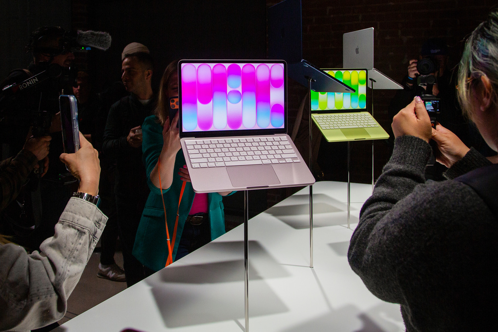 Members of the media view MacBook Neo laptop computers on display during an Apple unveil event, Wednesday, March 4, 2026, in New York (AP Photo/Ted Shaffrey) ,
