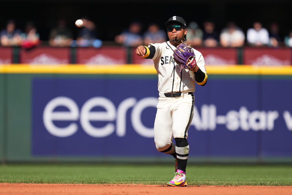 Seattle Mariners second baseman Michael Arroyo throws to first base off a ground ball hit by Athletics' Alika Williams during the second inning of a baseball game Sunday, Sept. 6, 2026, in Seattle. (AP Photo/Eric Hiller)