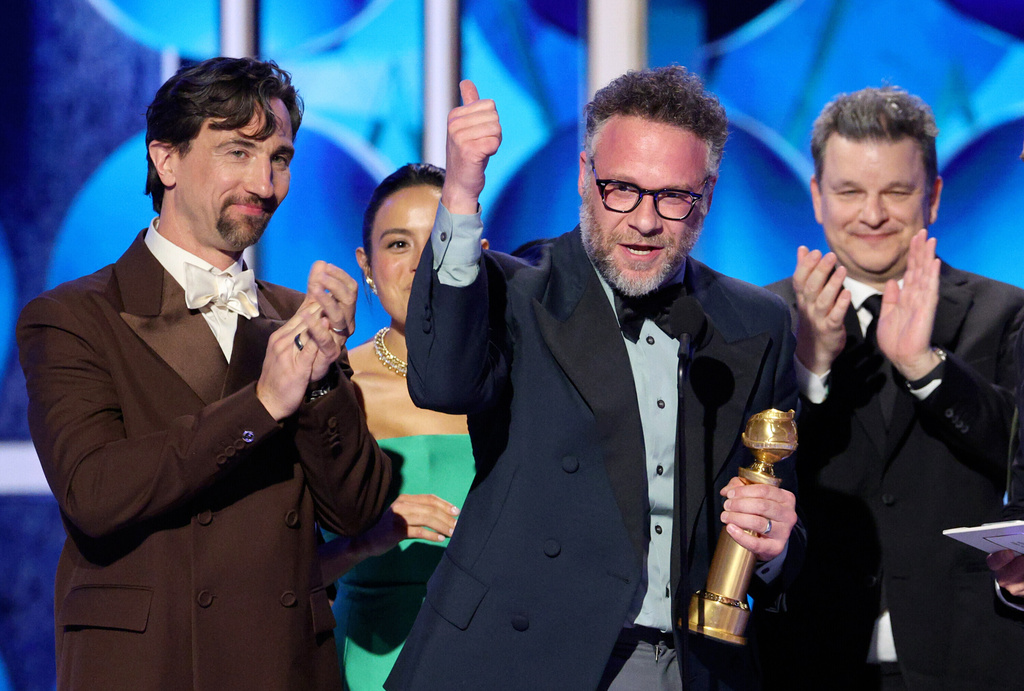 This image released by CBS Broadcasting shows James Weaver, from left, Chase Sui Wonders, Seth Rogen and Alex Gregory accepting the award for best TV series, musical or comedy for "The Studio" during the 83rd Golden Globes on Sunday, Jan. 11, 2026, at the Beverly Hilton in Beverly Hills, Calif. (Kevork Djansezian/CBS Broadcasting via AP)