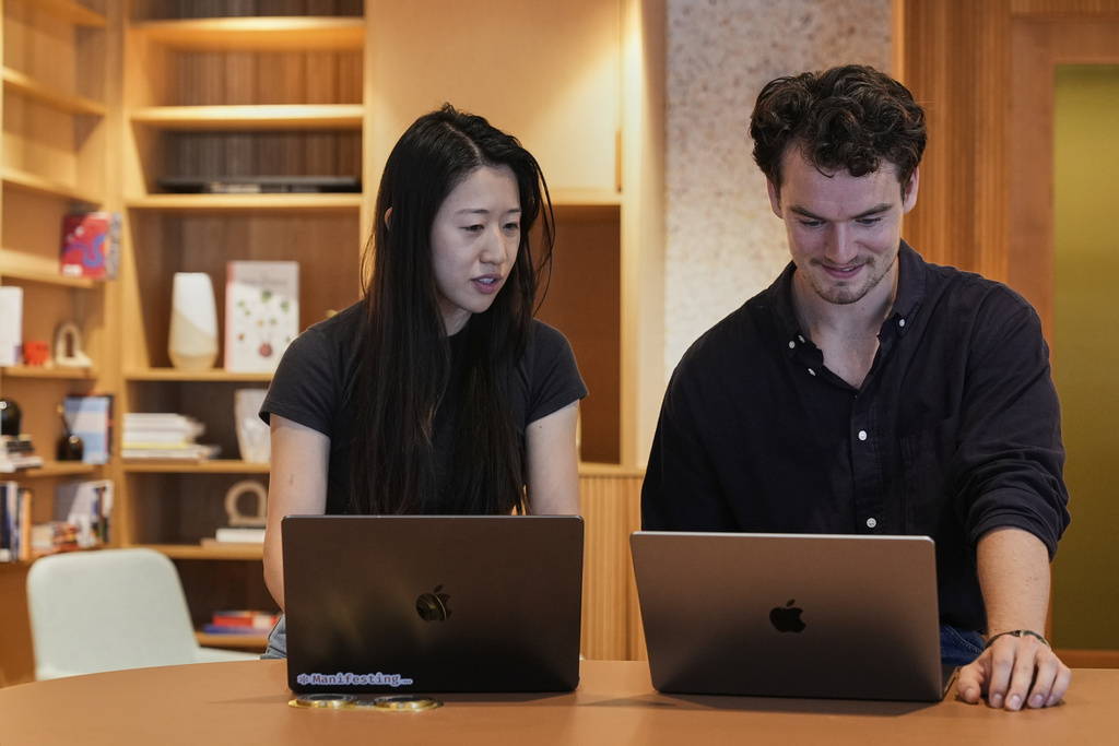 Claude code product manager Cat Wu, left, and Alex Albert, head of Claude relations, work inside Anthropic headquarters in San Francisco, Wednesday, Aug. 27, 2025. (AP Photo/Godofredo A. Vásquez)