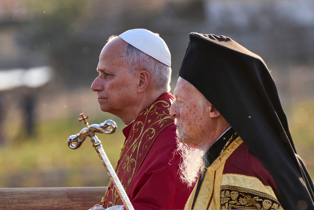 Pope Leo XIV and Ecumenical Patriarch Bartholomew I, right, leave at the end of an Ecumenical prayer service near the archaeological site of the ancient Basilica of Saint Neophytos in Iznik, Turkey, on Friday, November 28, 2025. (AP Photo/Domenico Stinellis)