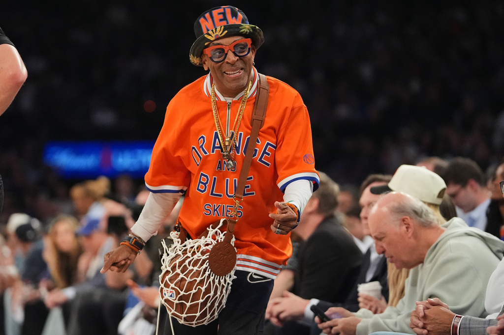 Spike Lee smiles during the first half in Game 5 of a first-round NBA playoffs basketball series between the New York Knicks and the Atlanta Hawks, Tuesday, April 28, 2026, in New York. (AP Photo/Frank Franklin II)
