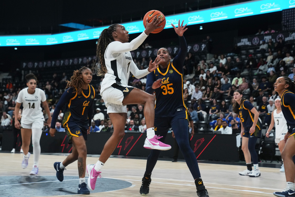 Vanderbilt guard Mikayla Blakes (1) drives on California center Sakima Walker (35) in the first half of an NCAA college basketball game Monday, Nov. 3, 2025 in Paris. (AP Photo/Thibault Camus)
