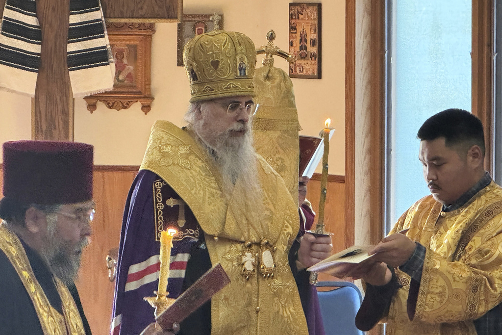 Archbishop Alexei of the Diocese of Sitka and Alaska, center, leads a prayer service for peace in the Russia-Ukraine War, Tuesday, Aug. 12, 2025, at the Saint Innocent Cathedral in Anchorage, Alaska, ahead of a U.S.-Russia summit. (AP Photo/Mark Thiessen)