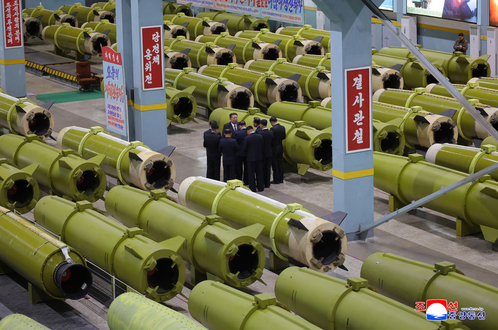 In this undated photo provided Friday, Dec. 26, 2025, by the North Korean government, its leader Kim Jong Un inspects missile and shell production at a factory in an undisclosed location, North Korea. Independent journalists were not given access to cover the event depicted in this image distributed by the North Korean government. The content of this image is as provided and cannot be independently verified. Korean language watermark on image as provided by source reads: "KCNA" which is the abbreviation for Korean Central News Agency. (Korean Central News Agency/Korea News Service via AP)