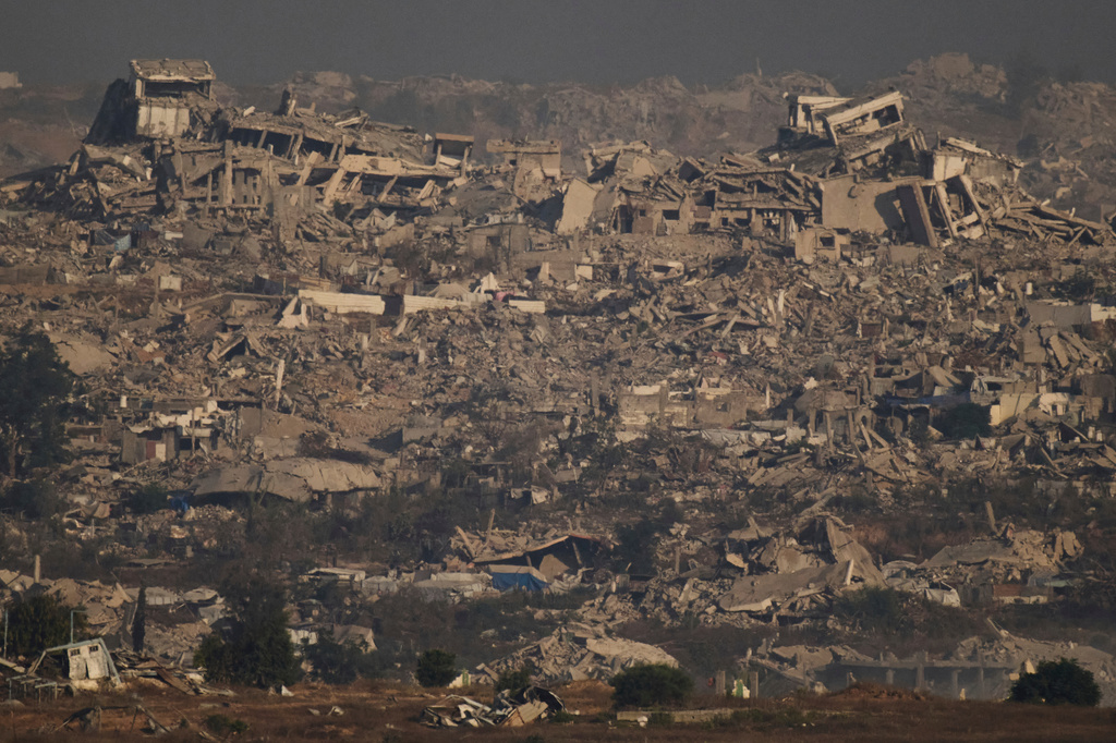 FILE - Buildings that were destroyed during the Israeli ground and air operations stand in northern of Gaza Strip as seen from southern Israel, Thursday, July 10, 2025. (AP Photo/Leo Correa, File)